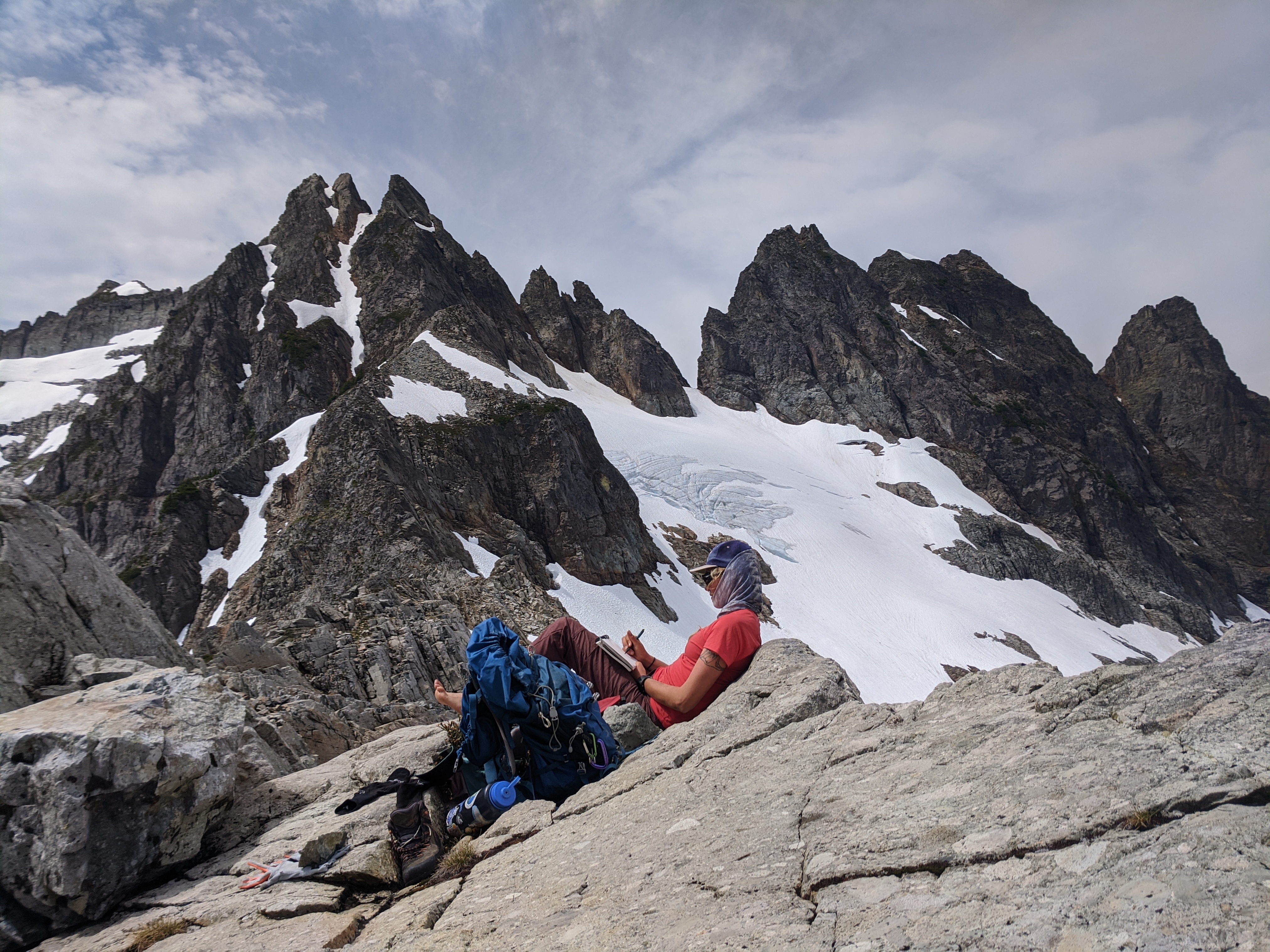Credit: Mariama Dryak; a female scientist takes field notes on glacier mass balance at the top of Columbia Glacier in the North Cascades, Washington, USA