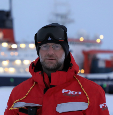 Matthew Shupe standing outside on the sea ice during the MOSAiC expedition to the Arctic