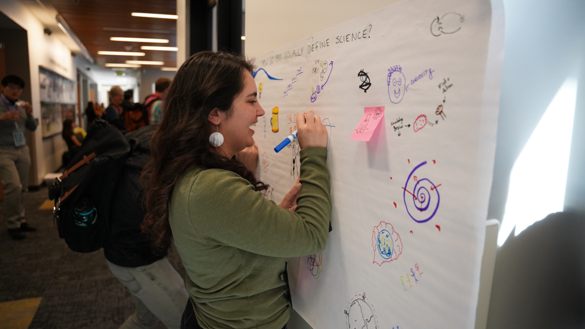 Polar Early Career World Summit (PECWS) participant and planning team member, Jacquelyn Veatch, draws a picture of how she visually defines science – contributing to a PECWS priority theme entitled ‘Broadening the definition of science’.