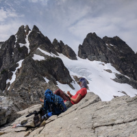 Credit: Mariama Dryak; a female scientist takes field notes on glacier mass balance at the top of Columbia Glacier in the North Cascades, Washington, USA