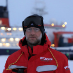 Matthew Shupe standing outside on the sea ice during the MOSAiC expedition to the Arctic